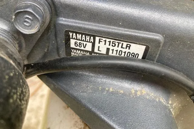 Slide: The Image of Yamaha F115TLR engine label on a 1991 Parker 1801 Center Console boat. - 5