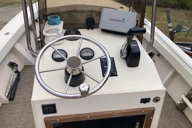 Slide: The Image of 1991 Parker 1801 Center Console boat dashboard with Garmin navigation system. - 8