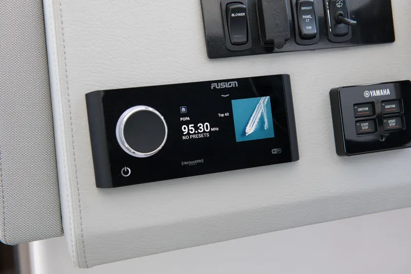 Slide: The Image of Control panel of 2026 Regal 36 Grande Coupe with Fusion audio system and Yamaha ignition. - 16