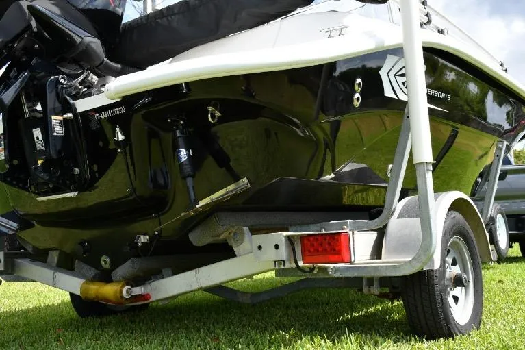 Slide: The Image of 2022 ALK2 Powerboats 18CRS on trailer, black hull, outdoor setting. - 16