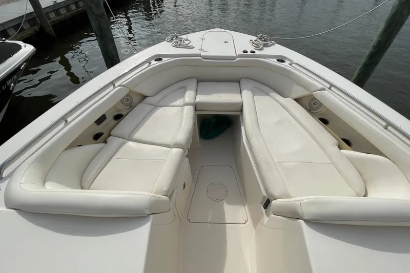 Slide: The Image of 2016 Grady-White Freedom 335 boat with spacious white seating area at the bow. - 13