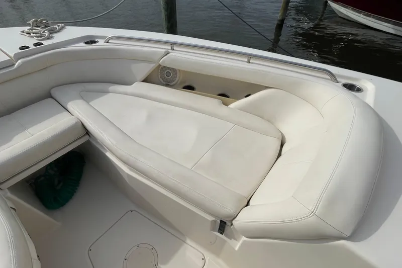 Slide: The Image of 2016 Grady-White Freedom 335 boat interior with white cushioned seating. - 15