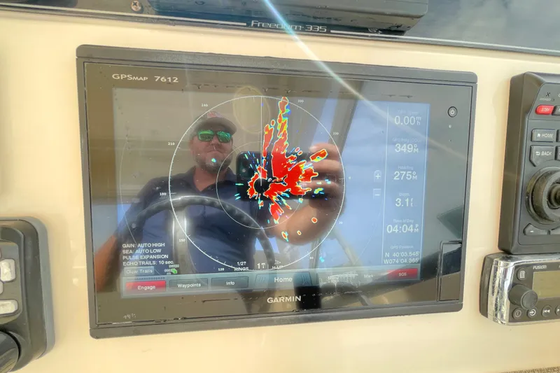 Slide: The Image of Garmin GPS display on 2016 Grady-White Freedom 335 boat dashboard. - 25