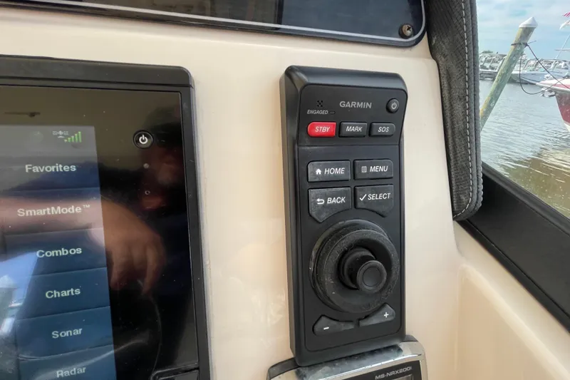 Slide: The Image of Control panel of a 2016 Grady-White Freedom 335 boat with Garmin navigation system. - 26