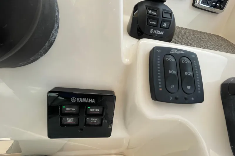Slide: The Image of Control panel of a 2016 Grady-White Freedom 335 boat with Yamaha ignition switches. - 28