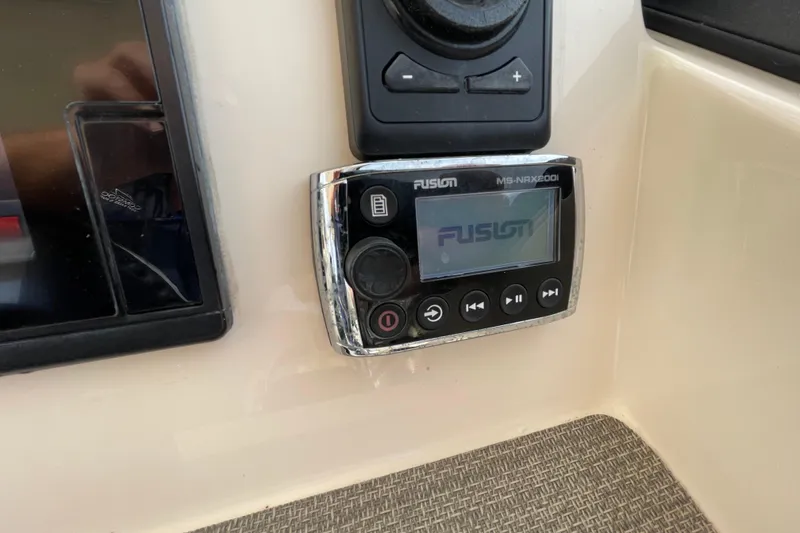 Slide: The Image of Fusion marine stereo system on 2016 Grady-White Freedom 335 boat dashboard. - 31