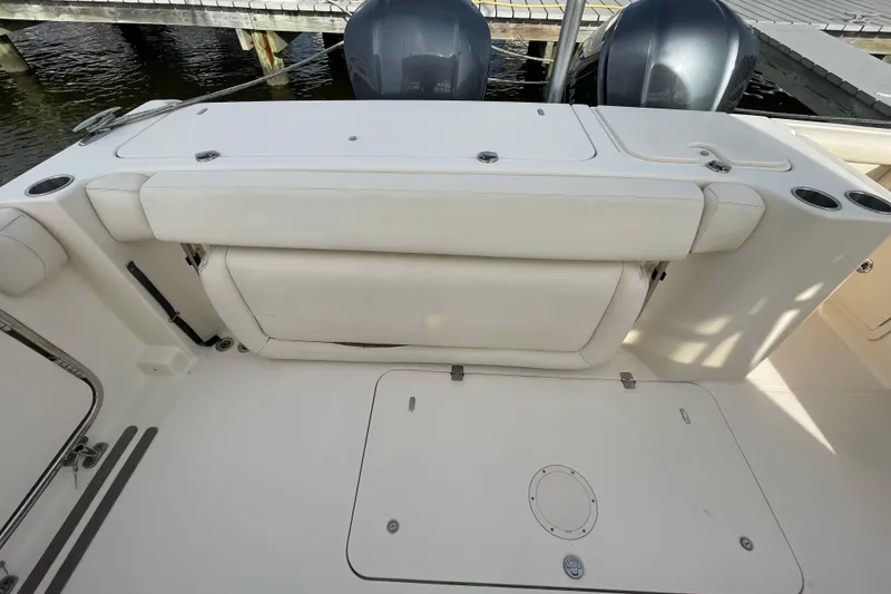 Slide: The Image of 2016 Grady-White Freedom 335 boat interior with seating and storage compartments. - 37