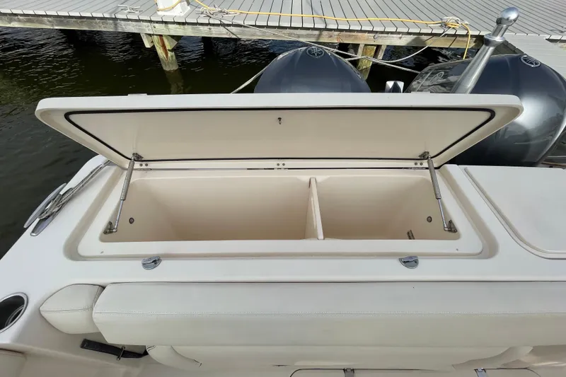 Slide: The Image of Open storage compartment on a 2016 Grady-White Freedom 335 boat, dockside view. - 40