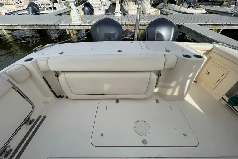 Slide: The Image of 2016 Grady-White Freedom 335 boat interior with seating and storage at dock. - 44