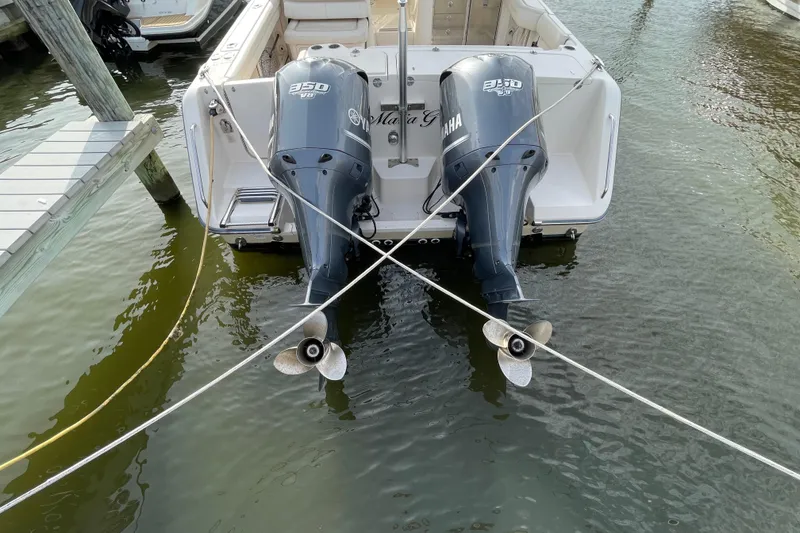 Slide: The Image of 2016 Grady-White Freedom 335 boat with twin Yamaha 350 engines docked in water. - 47