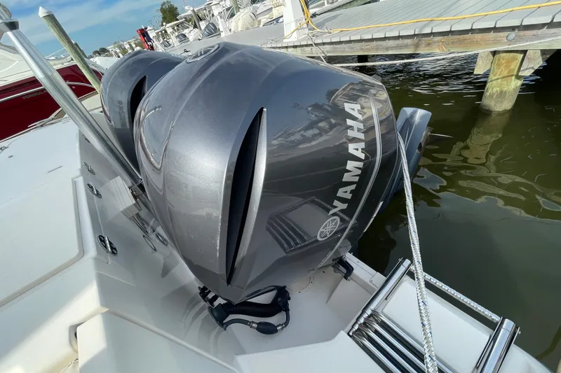 Slide: The Image of 2016 Grady-White Freedom 335 with dual Yamaha outboard engines docked at marina. - 54