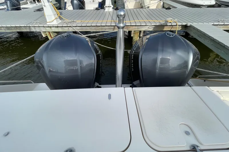 Slide: The Image of 2016 Grady-White Freedom 335 boat with dual Yamaha outboard engines at dock. - 55