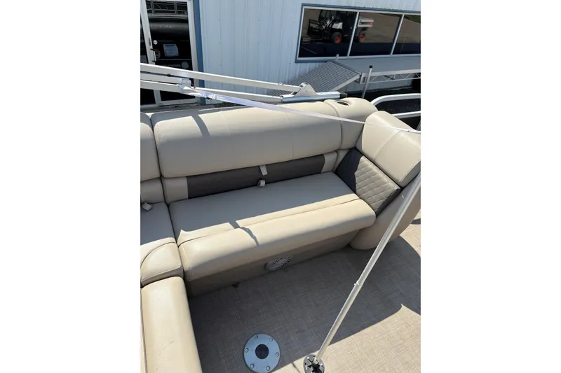 Slide: The Image of 2022 Sun Tracker Party Barge 20 DLX with beige seating and outdoor setting. - 11