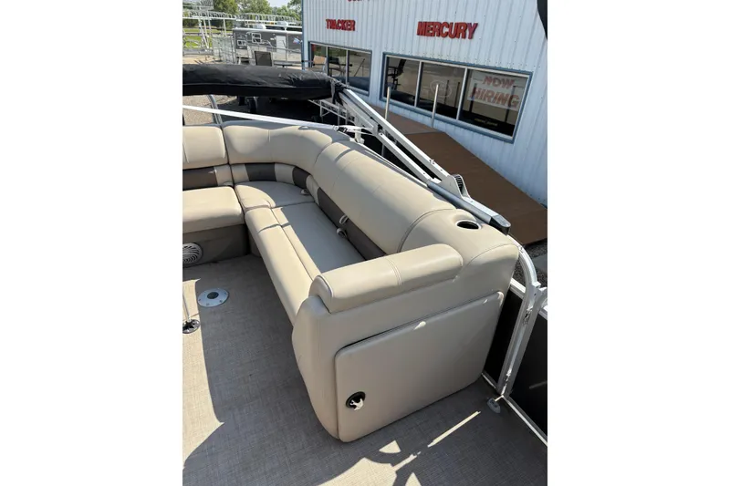 Slide: The Image of 2022 Sun Tracker Party Barge 20 DLX with beige seating and outdoor setting. - 16
