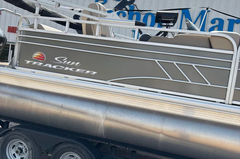 Slide: The Image of 2022 Sun Tracker Party Barge 20 DLX pontoon boat on trailer, side view. - 3