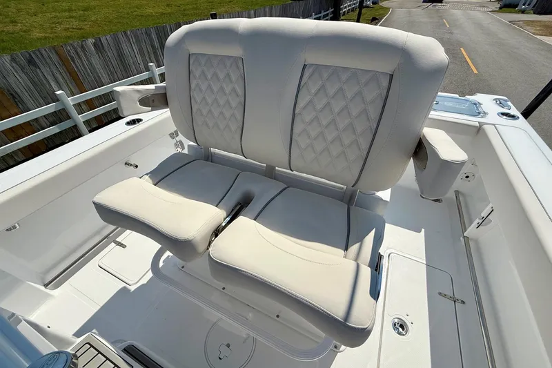 Slide: The Image of Luxurious seating on 2026 Sea Hunt Gamefish 25 boat, featuring diamond-stitched upholstery. - 10