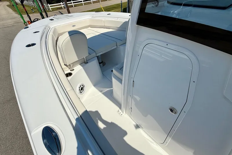 Slide: The Image of 2026 Sea Hunt Gamefish 25 boat interior with seating and storage compartment. - 13