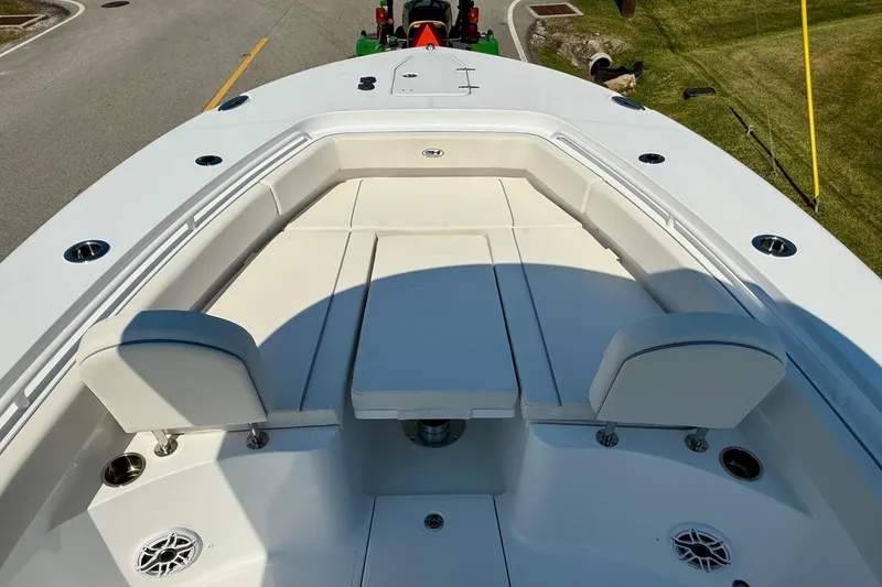 Slide: The Image of 2026 Sea Hunt Gamefish 25 boat interior with cushioned seating and cup holders. - 15