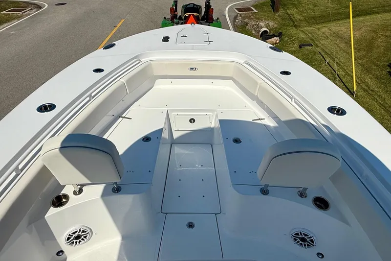 Slide: The Image of 2026 Sea Hunt Gamefish 25 boat interior with seating and rod holders. - 16