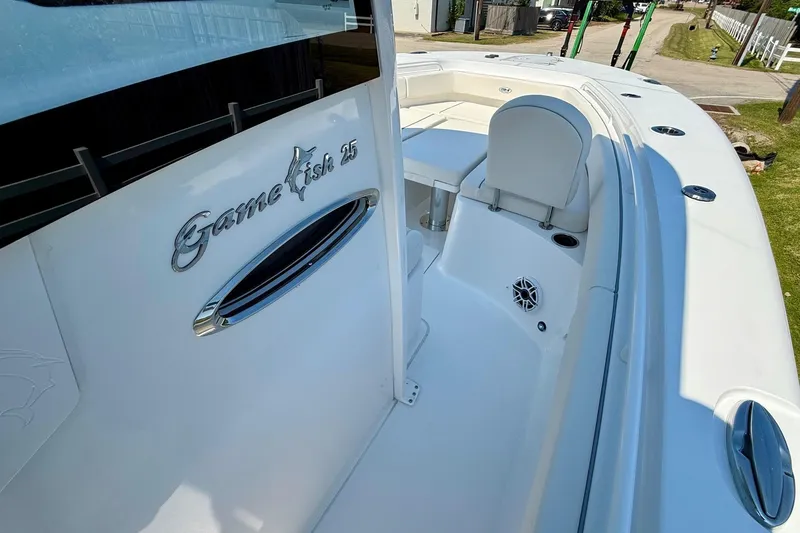 Slide: The Image of 2026 Sea Hunt Gamefish 25 boat interior, showcasing sleek design and seating area. - 17