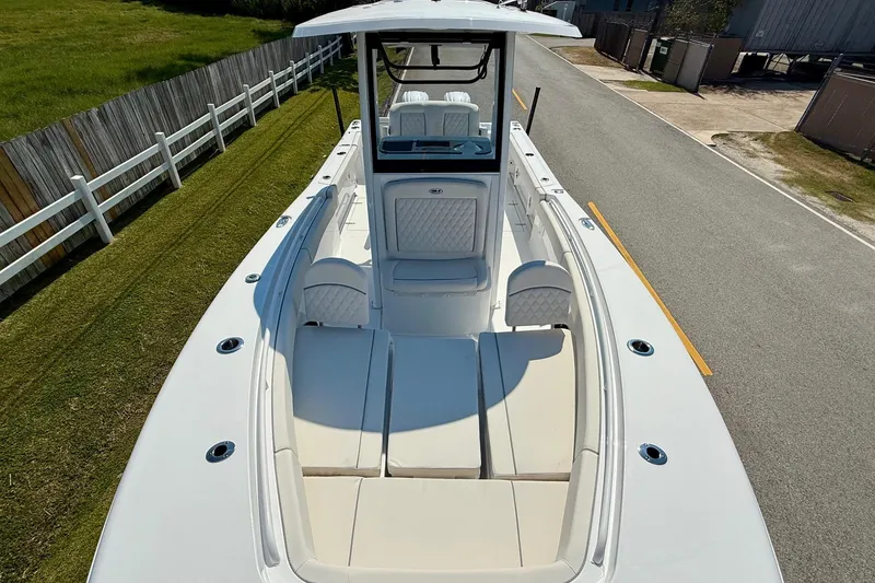 Slide: The Image of 2026 Sea Hunt Gamefish 25 boat with spacious seating and sleek design. - 18