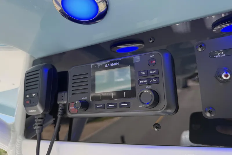 Slide: The Image of Garmin marine radio on 2026 Sea Hunt Gamefish 25 boat dashboard with blue LED lights. - 20