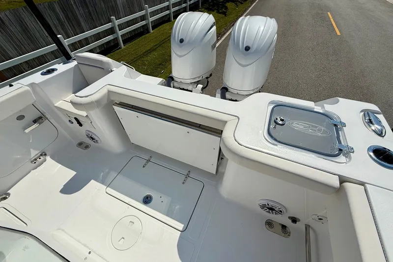 Slide: The Image of 2026 Sea Hunt Gamefish 25 boat interior with dual engines and fishing amenities. - 8