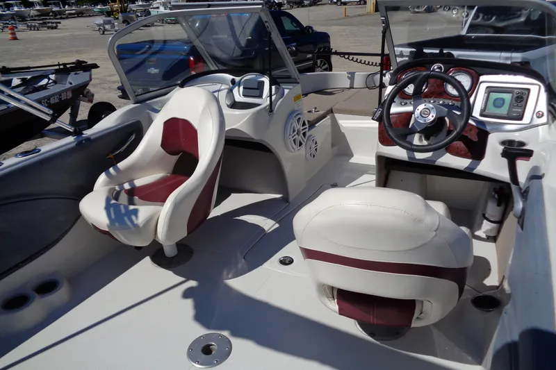 Slide: The Image of Interior of 2011 Nitro 290 boat with steering wheel and seating. - 10