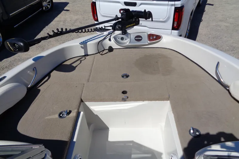 Slide: The Image of 2011 Nitro 290 boat interior with trolling motor and spacious deck. - 11