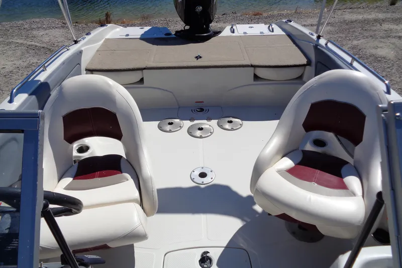 Slide: The Image of Interior of 2011 Nitro 290 boat with two cushioned seats and deck view. - 12