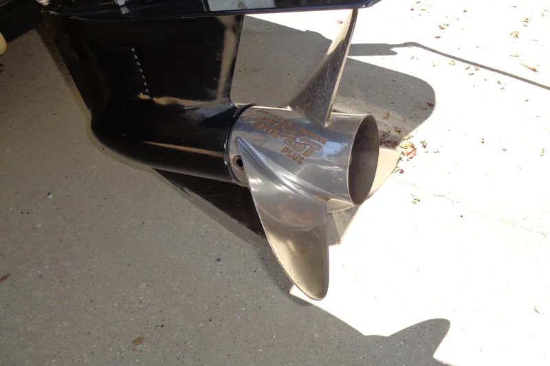 Slide: The Image of Close-up of a 2011 Nitro 290 boat propeller on a concrete surface. - 22