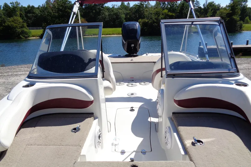 Slide: The Image of 2011 Nitro 290 boat interior with seating, windshield, and water view. - 5