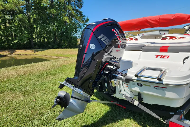 Slide: The Image of 2022 Tahoe T18 boat with Mercury Pro XS outboard motor on grassy area. - 3