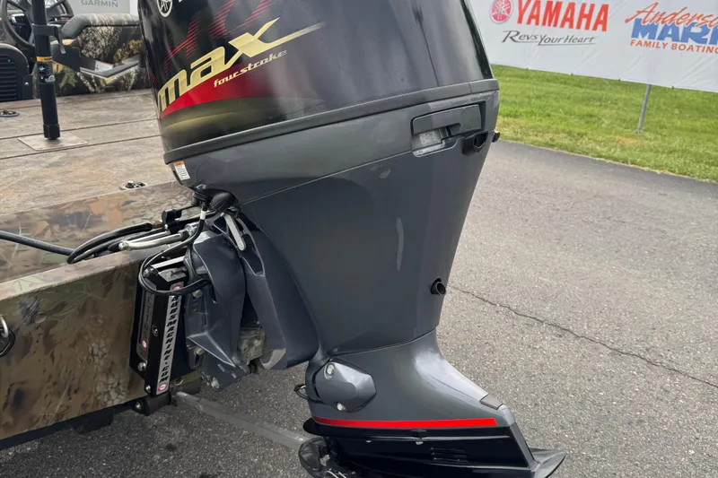 Slide: The Image of 2021 G3 Sportsman 1710 Camo boat with Yamaha outboard motor, parked outdoors. - 10