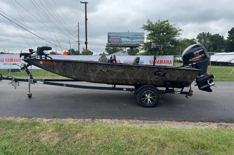 Slide: The Image of 2021 G3 Sportsman 1710 Camo boat with Yamaha engine on trailer. - 2