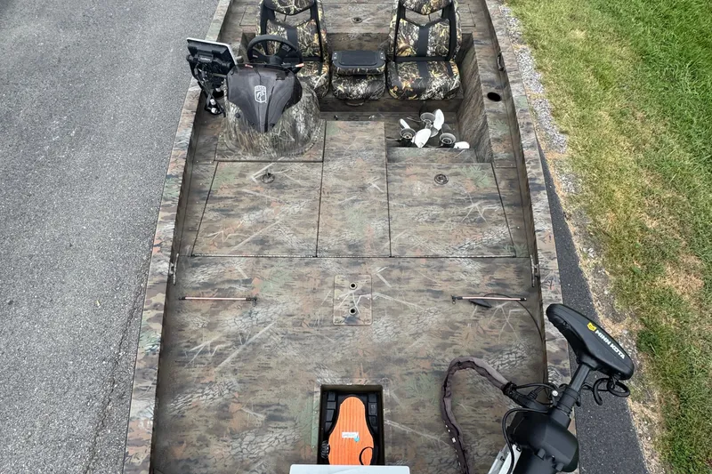 Slide: The Image of 2021 G3 Sportsman 1710 Camo boat with camouflage design and fishing equipment. - 4