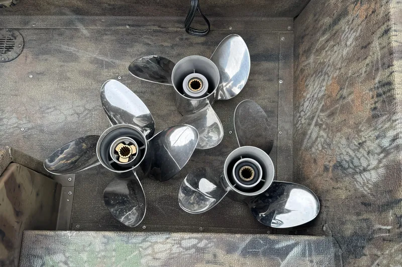 Slide: The Image of Three boat propellers on a camo-patterned G3 Sportsman 1710 Camo, 2021 model. - 8