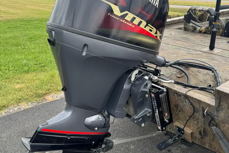 Slide: The Image of 2021 G3 Sportsman 1710 Camo with Yamaha Vmax outboard motor, parked on pavement. - 9