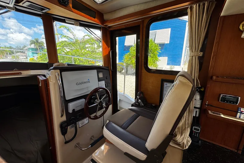 Slide: The Image of Interior of 2014 Ranger Tugs R-31 CB with Garmin navigation system and captain's chair. - 7