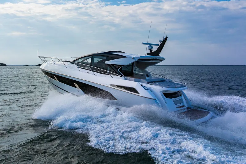 Slide: The Image of Luxurious 2021 Sunseeker 60 Evo yacht cruising on open water. - 16