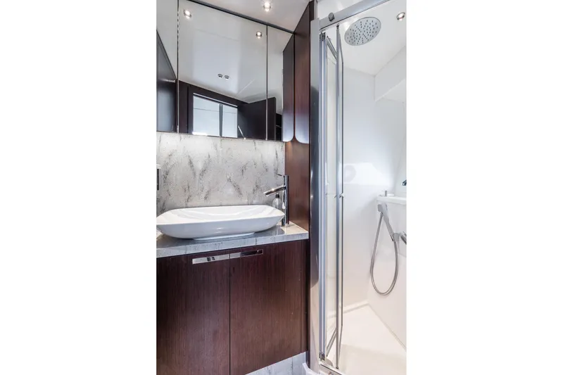 Slide: The Image of Luxurious bathroom in 2021 Sunseeker 60 Evo yacht with modern fixtures and elegant design. - 25
