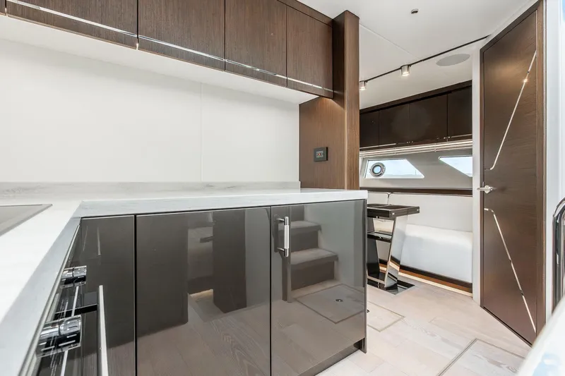 Slide: The Image of Luxurious interior of 2021 Sunseeker 60 Evo yacht with modern kitchen and dining area. - 34
