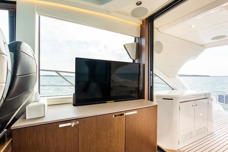 Slide: The Image of Luxurious interior of 2021 Sunseeker 60 Evo yacht with TV and ocean view. - 36