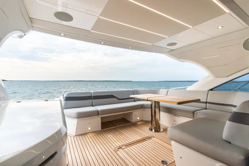 Slide: The Image of Luxurious Sunseeker 60 Evo yacht interior, featuring elegant seating and ocean view, 2021 model. - 37