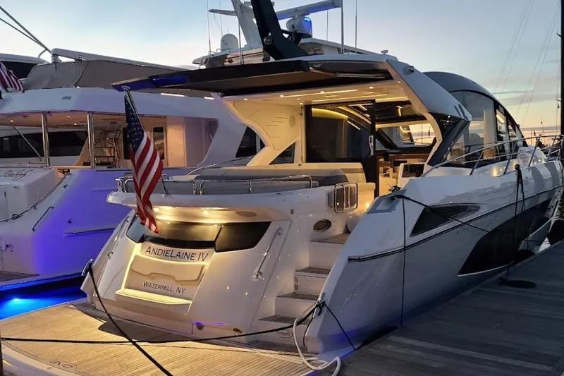 Slide: The Image of 2021 Sunseeker 60 Evo yacht cruising on open water, aerial view. - 4