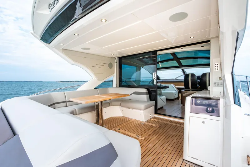 Slide: The Image of Luxurious 2021 Sunseeker 60 Evo yacht with elegant outdoor seating and ocean view. - 42