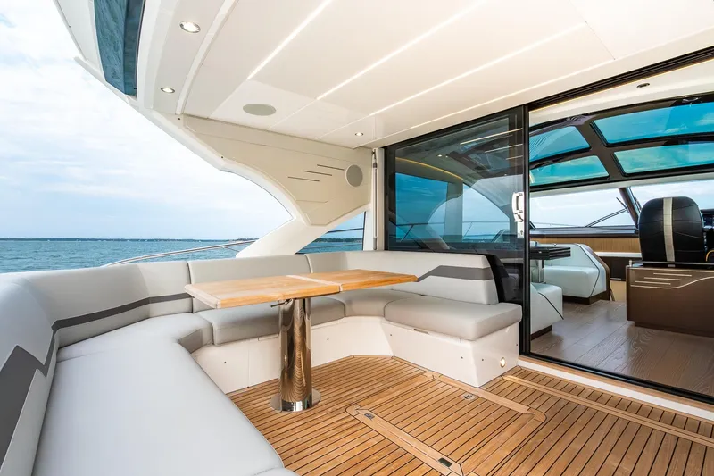 Slide: The Image of Luxurious 2021 Sunseeker 60 Evo yacht interior with elegant seating and ocean view. - 43