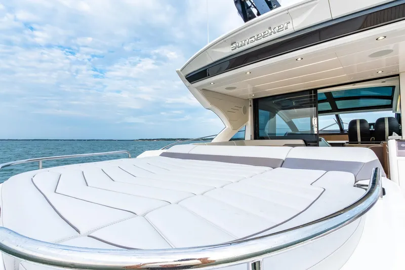 Slide: The Image of Luxurious 2021 Sunseeker 60 Evo yacht with spacious deck and sleek design on open water. - 49