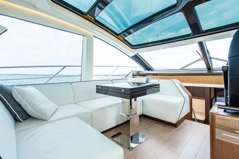 Slide: The Image of Luxurious interior of 2021 Sunseeker 60 Evo yacht with modern seating and panoramic windows. - 58