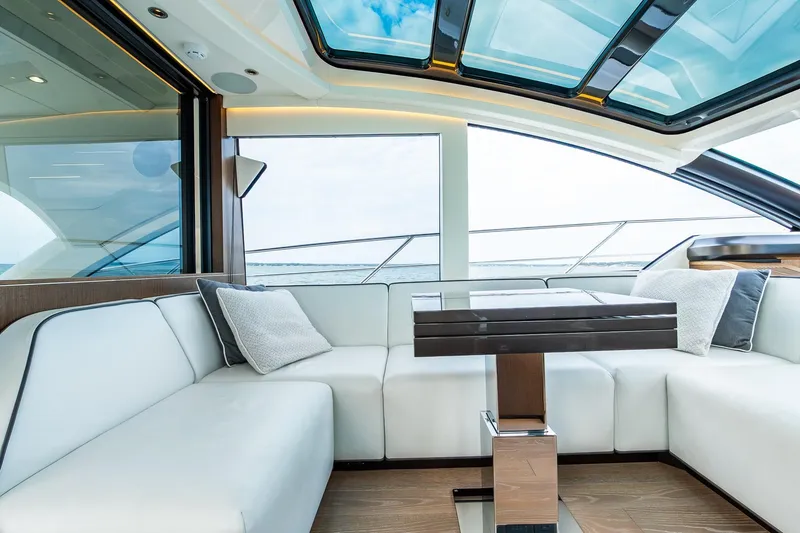 Slide: The Image of Luxurious interior of 2021 Sunseeker 60 Evo yacht with elegant seating and panoramic windows. - 59